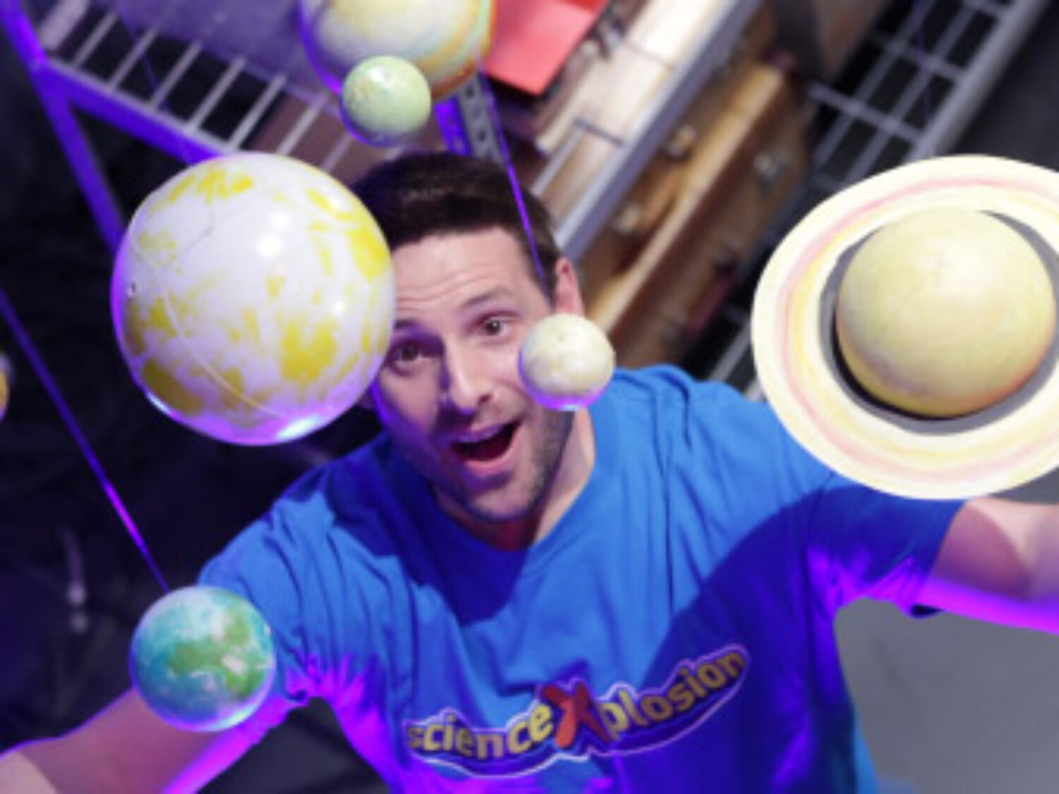 Eric from ScienceXplosion looking at a model of the solar system