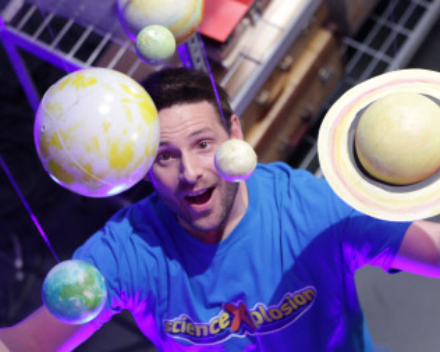 Eric from ScienceXplosion looking at a model of the solar system